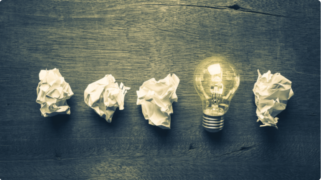 Image of a light blub amongst crumpled papers