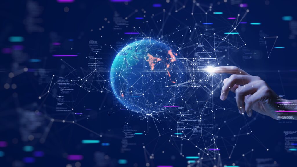 digital image of world and a hand hand touching the globe
